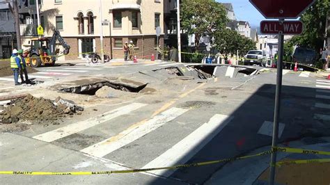 Massive sinkhole forms in SF intersection after water main break